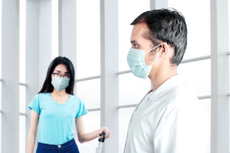 Asian doctor checking woman health before traveling in the hospital. Medical check up before...