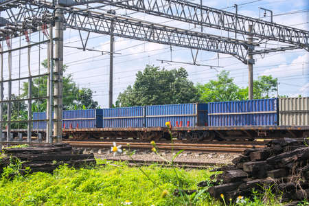 Freight train locomotive carrying with cargo with blue sky backgroundの写真素材