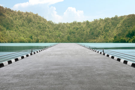 Asphalt road with valley view and blue sky backgroundの写真素材