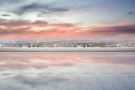 Rooftop view with modern cityscapes and dramatic sky background