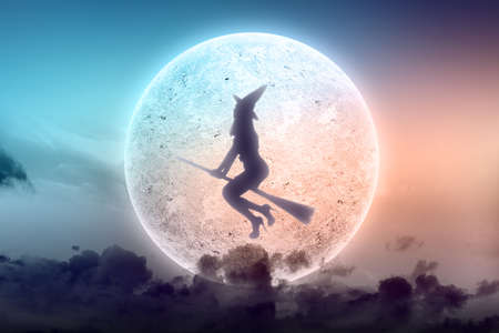 Silhouette of witch woman with a hat flying on a magic broomstick with a full moon background