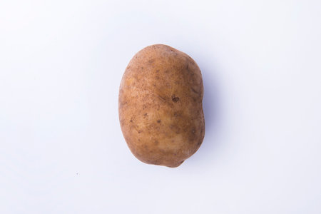 Fresh potato isolated over white backgroundの写真素材
