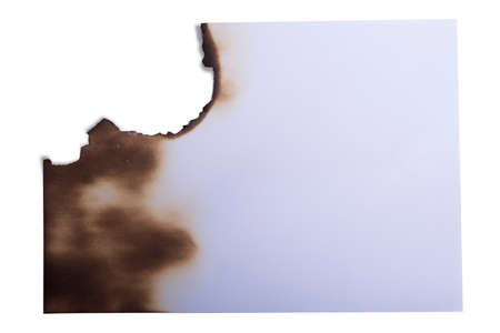 Burned white paper isolated over white background