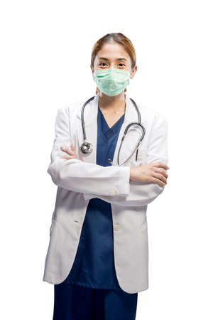 Asian female doctor with face mask and stethoscope isolated over white backgroundの写真素材