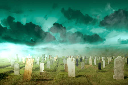 Tombstones on the graveyard with the dramatic scene background. Halloween conceptの写真素材