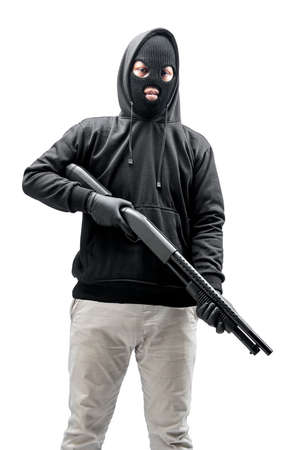 Criminal man in a hidden mask holding the shotgun isolated over white background