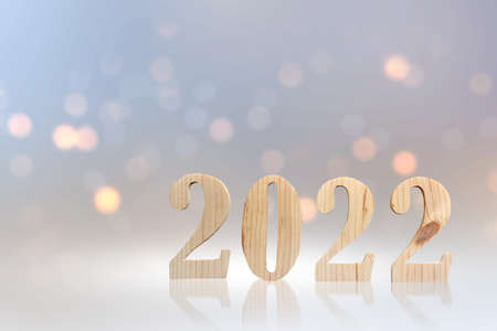 2022 with blurred light background. Happy New Year 2022