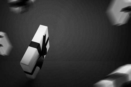 White gift box cap with a black ribbon with a black background. Black Friday conceptの写真素材