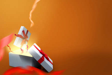 Opened a white gift box with a red ribbon with a colored background. Boxing Day