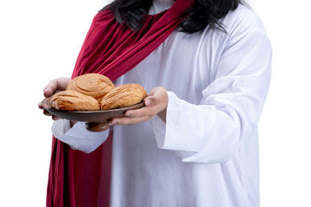Jesus Christ holding food isolated over white backgroundの写真素材