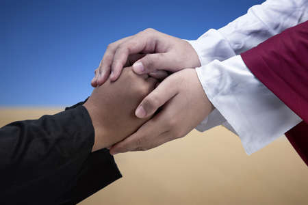 Jesus Christ gave his help to his follower with sky backgroundの写真素材