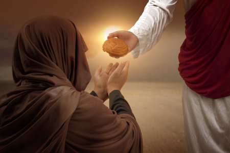Jesus Christ with open palm giving food to others with sunset white backgroundの写真素材