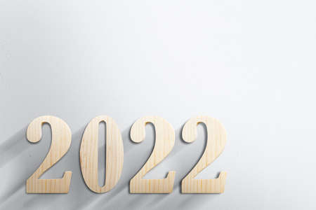 2022 with white wall background. Happy New Year 2022の写真素材