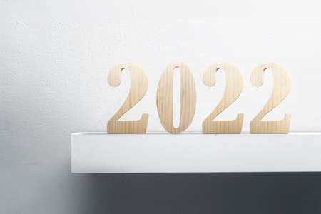 2022 with white wall background. Happy New Year 2022の写真素材