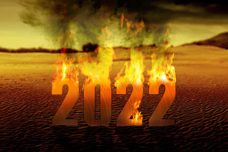 2022 on fires with dramatic background. Happy New Year 2022