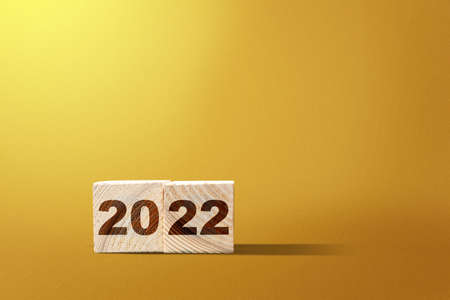 2022 on the wooden cube. Happy New Year 2022