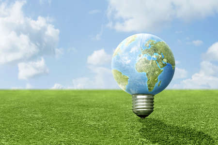Earth bulb on the green grass. Power Green Conceptの写真素材