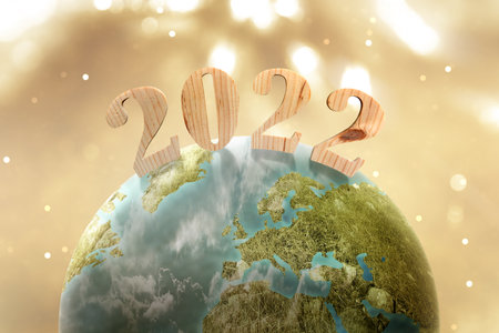 Earth with 2022 and blurred light background. Happy New Year 2022