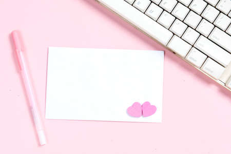 Empty white paper and heart with a colored background. Valentines Day. Empty space for copy space