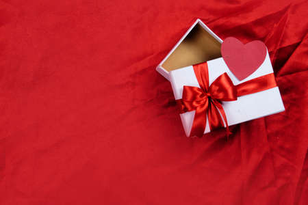 Heart and gift box with a colored background. Valentines day