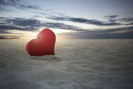 Heart on the sand with a dramatic sky background. Valentines dayの写真素材