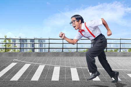 Asian nerd with ugly face running with increases graph on the street background