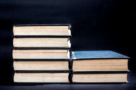 Stack of books with dark background