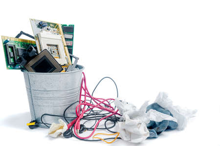 Garbage bin with discarded stuff isolated over white backgroundの写真素材