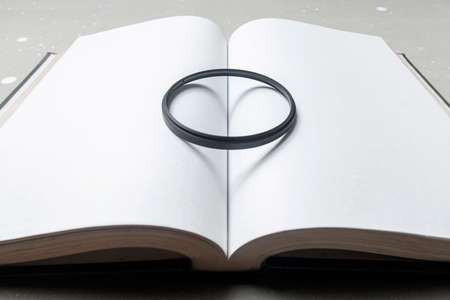 Closeup view of the opened book on the tableの写真素材