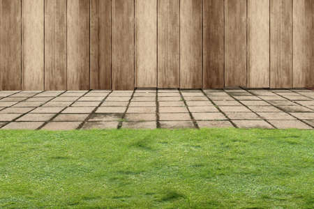 Green grass with wooden fence backgroundの写真素材