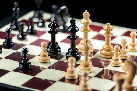 Chess pieces on the chessboard with black background