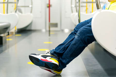 Close up view of man sitting on the train