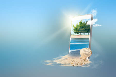 Mobile phone screen with a sandy beach with the blue ocean and blue sky background