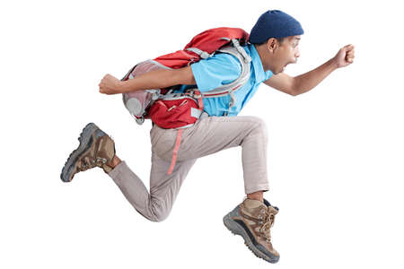 An Asian man with a beanie hat and backpack running isolated over white background