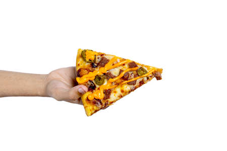 Hand holding a slice of pizza with beef and a cheese sauce isolated over white background
