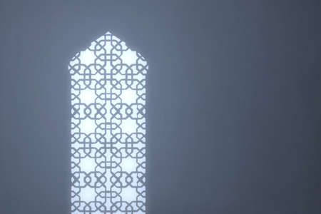 Mosque window with bright light backgroundの写真素材