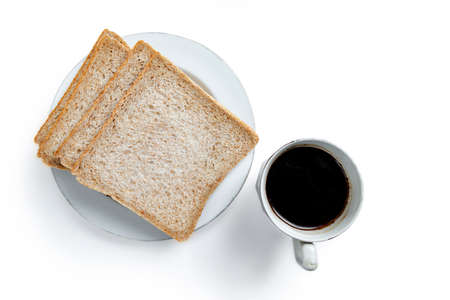 Sliced bread on the plate with a cup of coffee isolated over white backgroundの写真素材