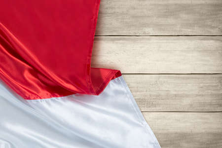 Red and white flag with wooden background. Indonesian independence day