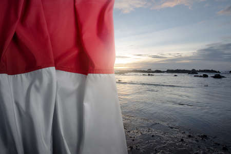 Indonesian flag waving with blue sky background