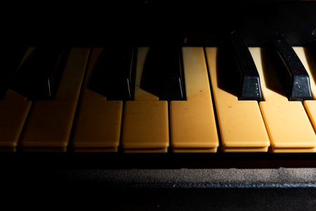 Closeup view of an electronic piano keyboard with dark background