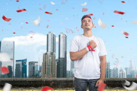 Indonesian men celebrate Indonesian independence day on 17 August. Indonesian independence day