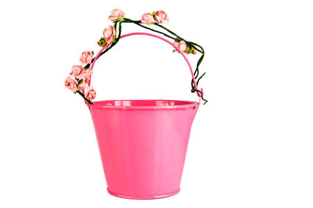 Colored bucket with flowers isolated over white backgroundの写真素材