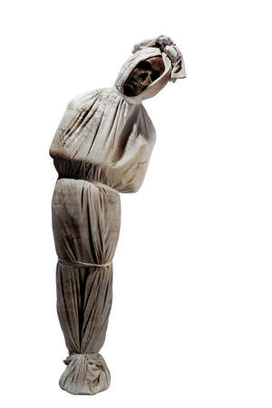 Indonesian ghost called pocong, covered with a linen shroud, isolated over white background
