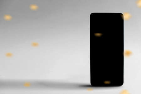 Mobile phone with a black screen with a white background. Black Friday concept