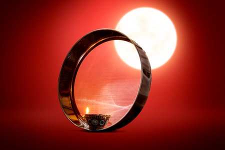 Karwa Chauth strainer and Diya oil lamps for the Karwa Chauth celebration on the nightの写真素材