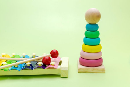 Colorful wooden pyramid and xylophone toy on a colored backgroundの写真素材