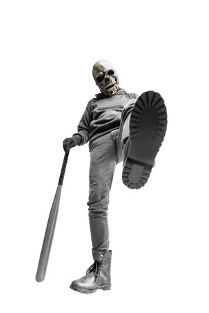 Man with a skull head costume for Halloween holding baseball bat isolated over white background