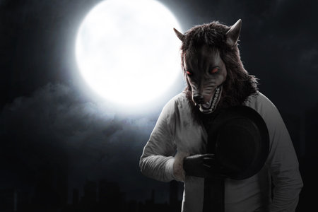A werewolf with a full moon and night scene background. Halloween conceptの写真素材