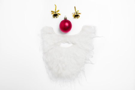 Santa Claus beard with Christmas bell and ball on white background. Christmas decorationの写真素材