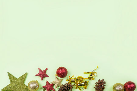 Pine cones and stars with Christmas bells and colorful Christmas balls with empty spaces on a...